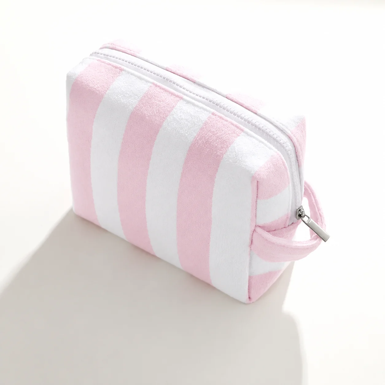 Pale pink and white pouch illustrating a developed product